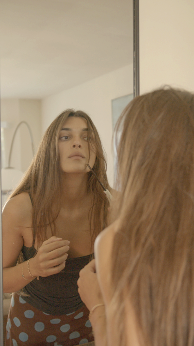 Zoe in a mirror, getting ready