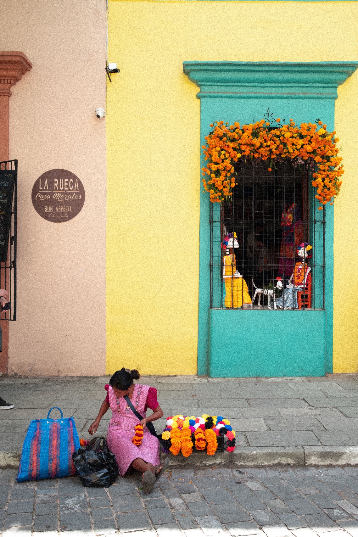 Oaxaca storefront with marigolds