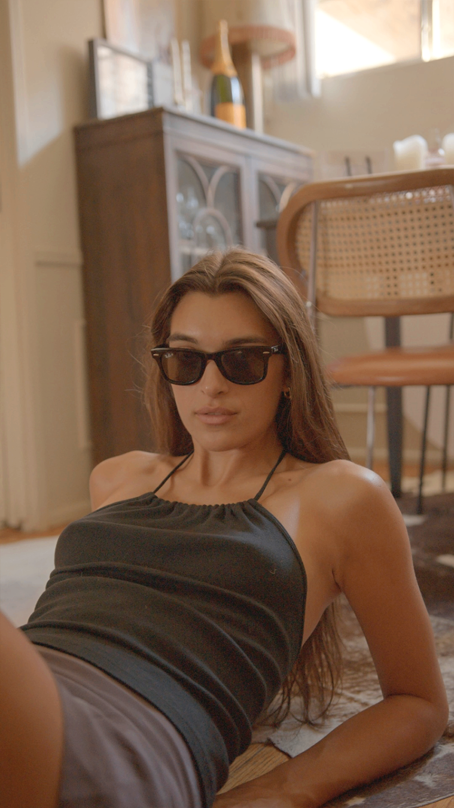 Zoe reclining in sunglasses